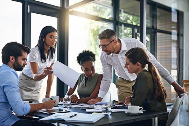 Group of Business People Around Table 640 x 427 Group of Business People Around Table 640 x 427